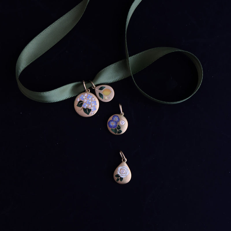 Jewelry set with pendants on a dark background