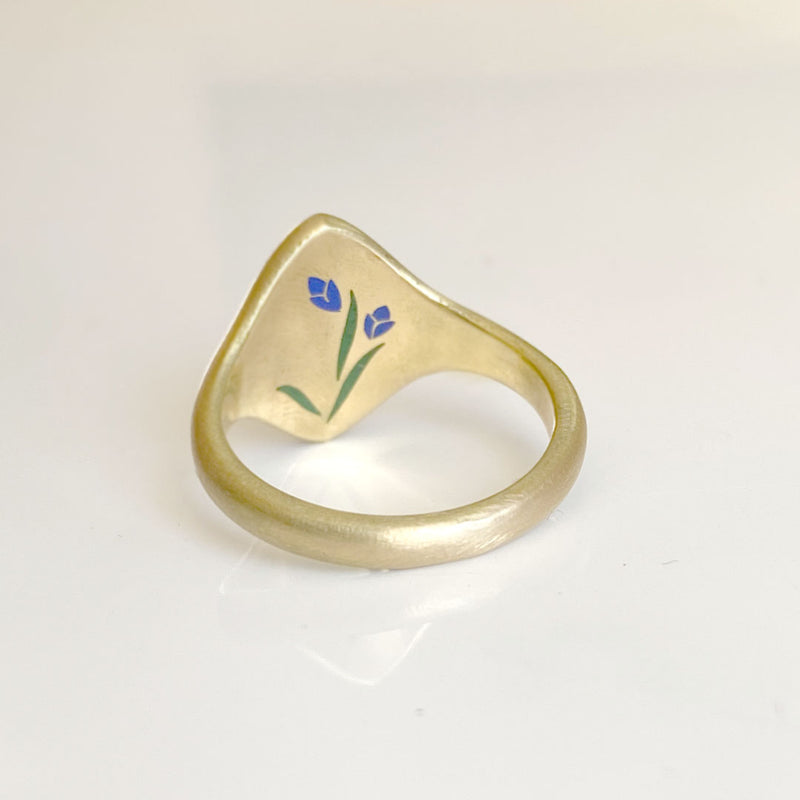 Inside of an iris signet ring with enamel details