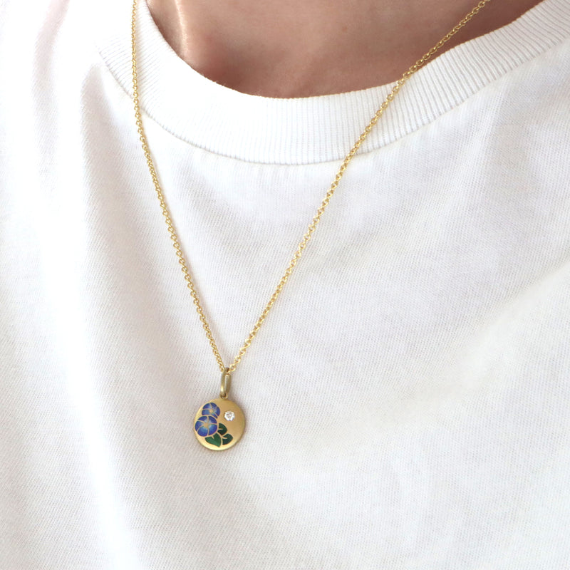 enamel gold necklace on a neck