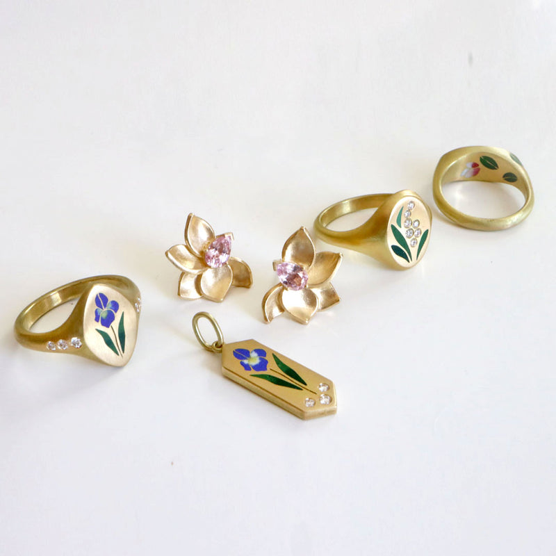 Jewelry with irises, magnolias and the lily of the valley